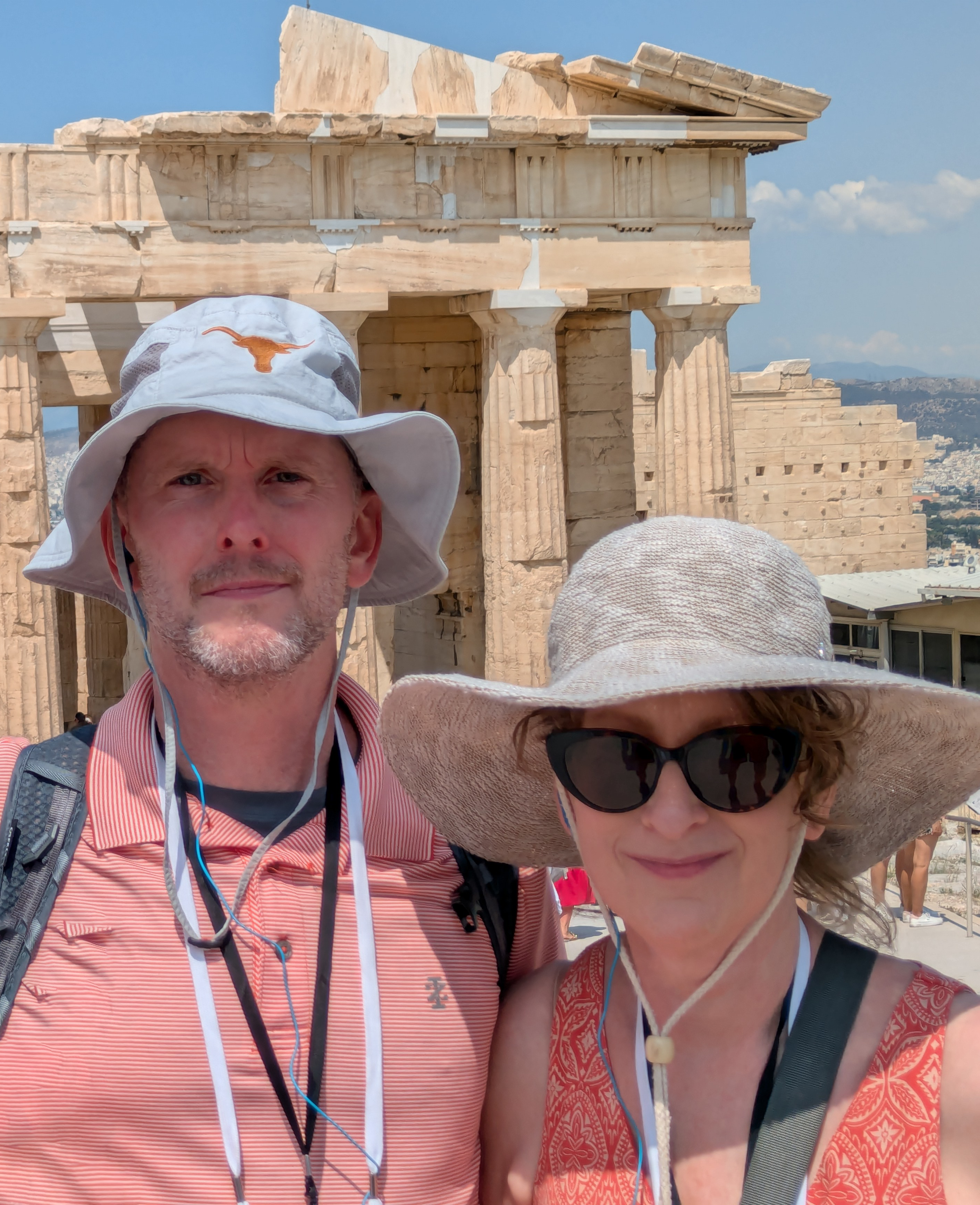 Catherine Hinton and husband pose for a selfie in front of ruins in Athens, Greece. 