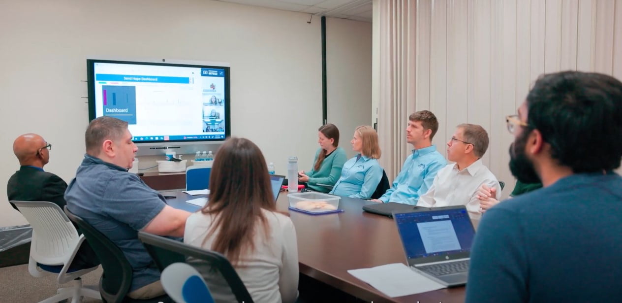 Students of the UTA College of Business BSBA capstone project meet with members of Send Hope to discuss their analysis of Sen Hopes data. (Photo by Jalen Larry)
