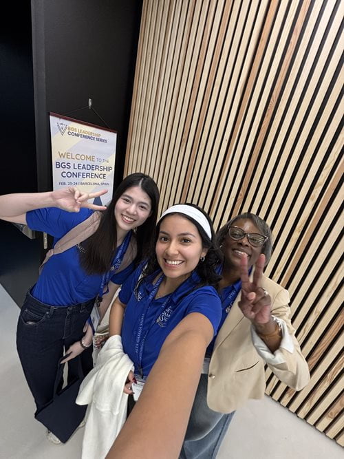 Vega, Phan and Dr. Cocchiara pose for a photo.