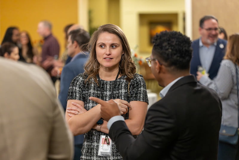 Attendees speak to each other during the networking portion of the event. Photo by Jalen Larry.
