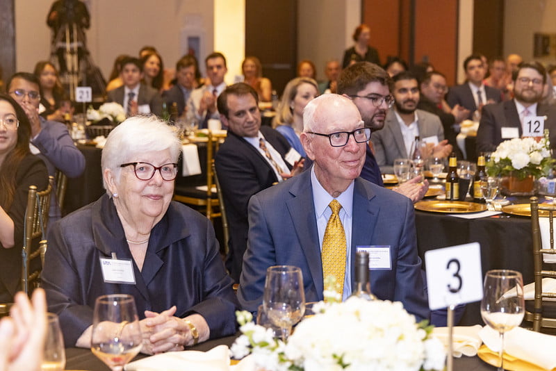 John and Judy Goolsby sit next to each other at a table during the 20th Anniversary celebration of the Goolsby Academy. 
