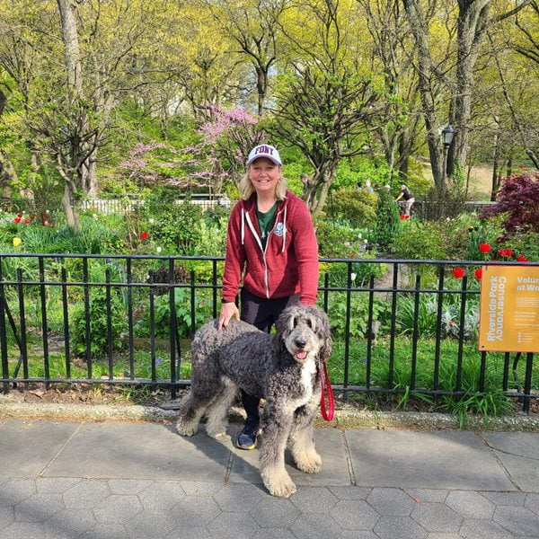 Jackie poses for a photo with her dog, George, in New York City.