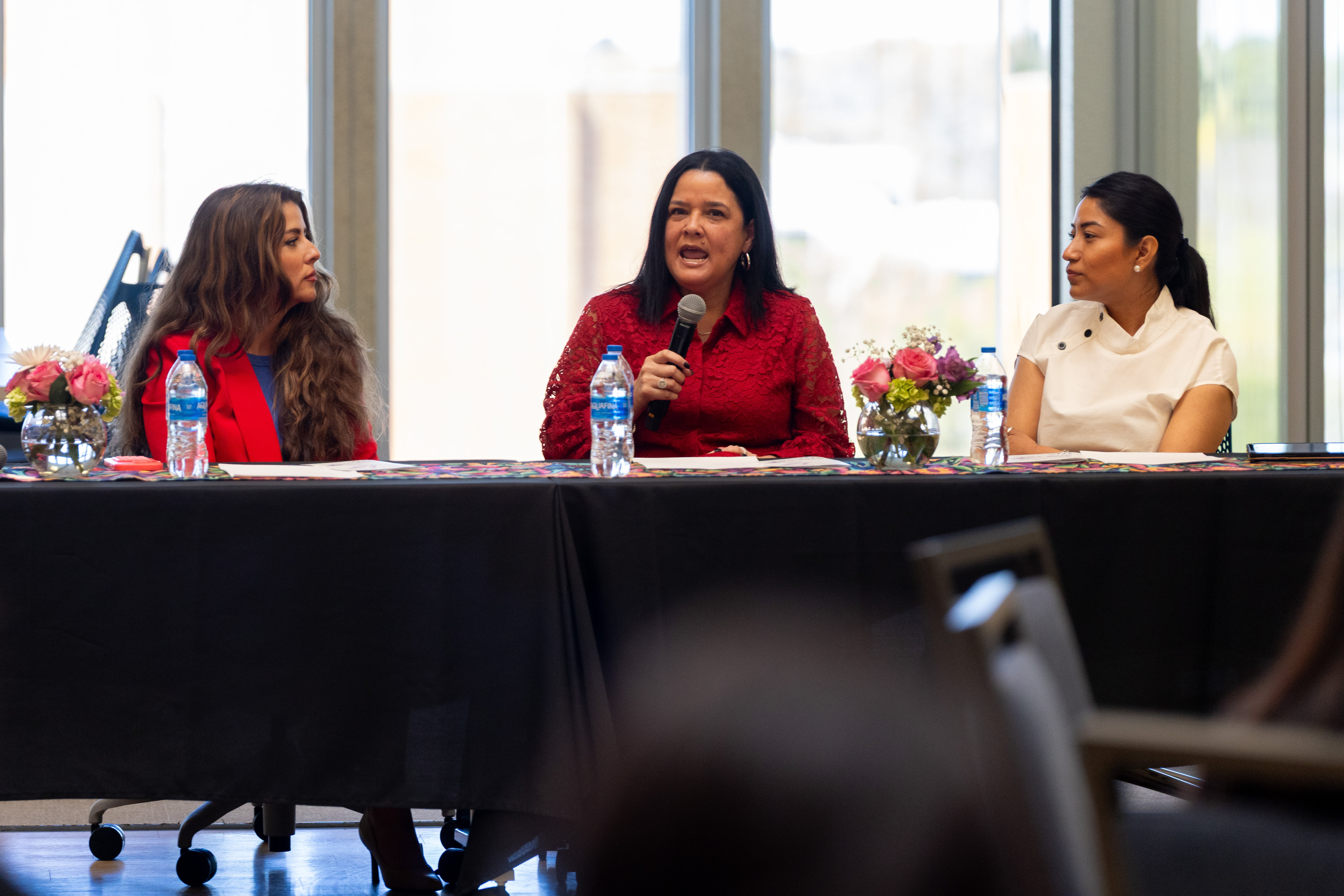 Panelists for the UTA College of Business Latinas in Business event, Brittney Garcia-Dumas, Owner of BGD Marketing (Left), Dr. Lesley Regalado, Program Director for the UTA College of Business Master of Science in Human Resources and Clinical Associate Professor (Center), and Nancy Reza, Co-founder of Taqueria El Arquito (Right) answer questions during the event. (Photo by Jalen Larry)