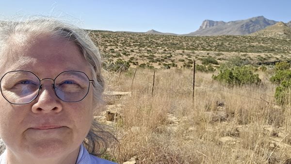 Linda Letherwood poses for a selfie in front of Guadalupe Mountains, east of El Paso.