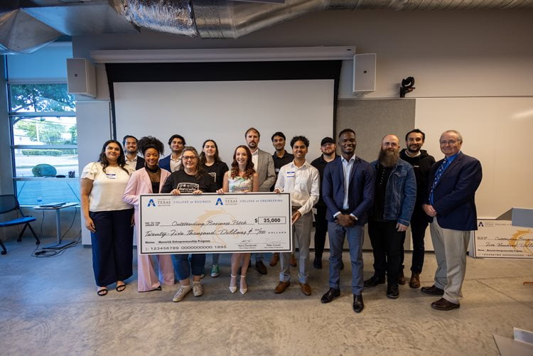 MAVPitch participants pose for a photo with a giant check after the competition on August 15th, 2024. (Photo by Jalen Larry)