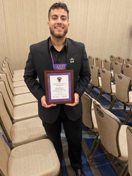 Jaafar Al Harbi, Delta Sigma Pi member with award from Grand Chapter Congres