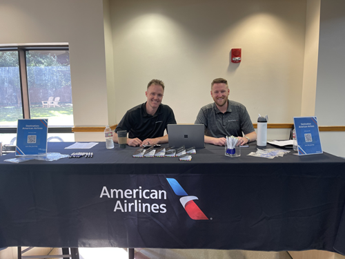 Photo of two American Airlines recruiters at an employer table,