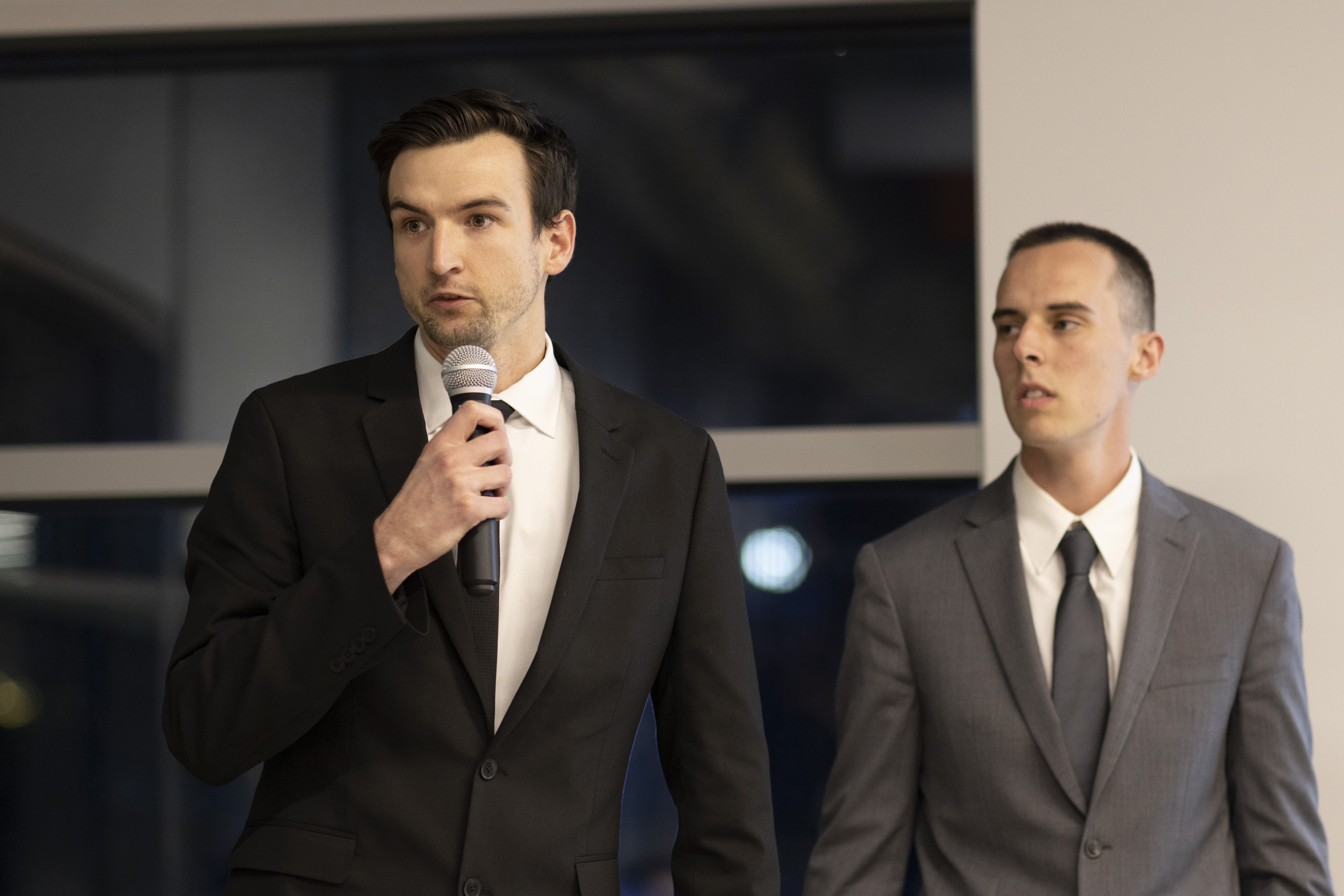 Two students pitch during a group pitching event on Dec. 13, 2022.