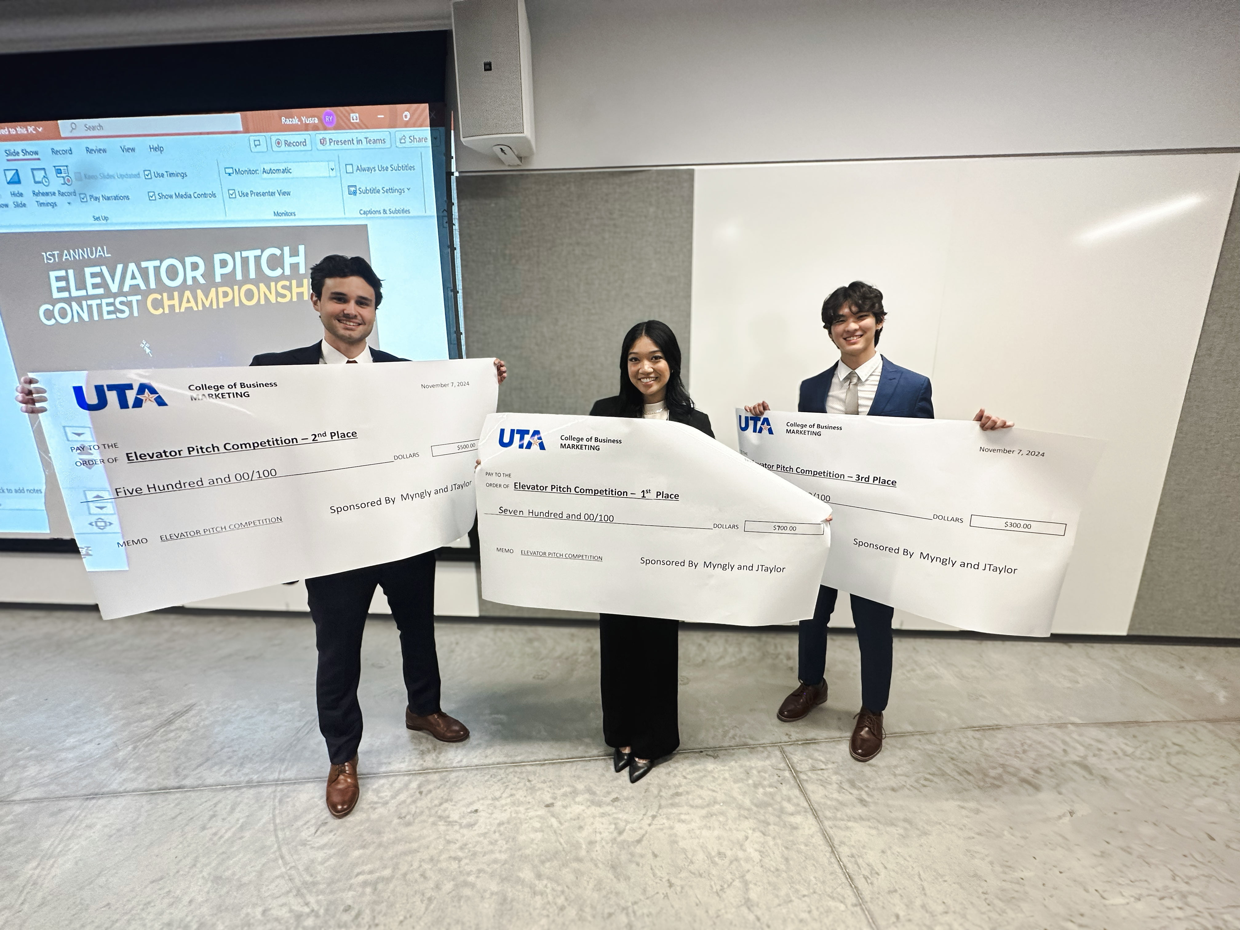 The winners of the Maverick Networking Night Elevator Pitch Competition, Matthew Logan (Left), Blossom Nguyen (Center), and Jesse Shin (Right) pose for a photo with their winnings. (Courtesy Photo)