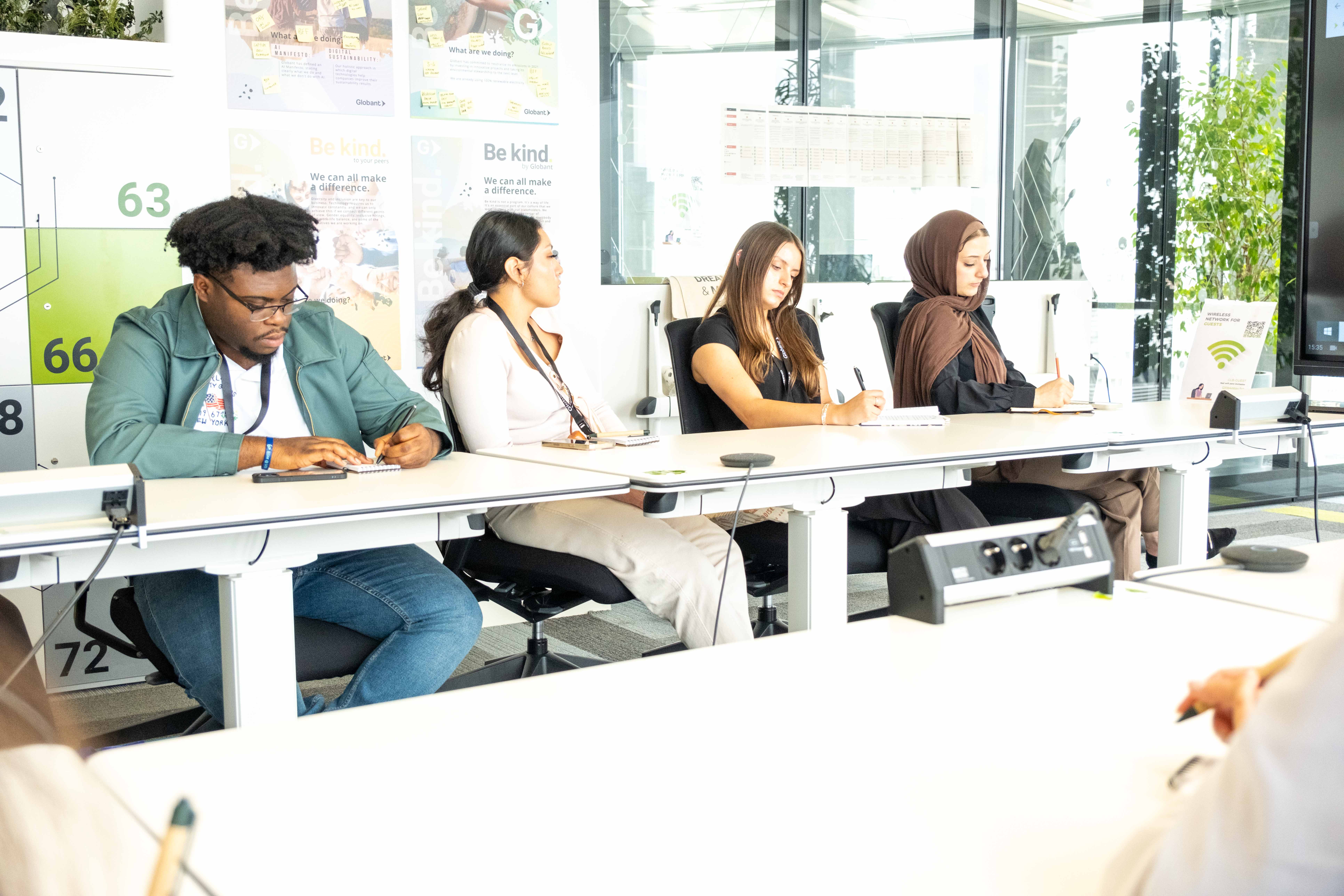 RISE Academy Students listen to business leaders during a visit to Globant, a software development company, in Madrid, Spain. (Photo by Jhonniece Meeks) 