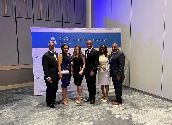 UTAVBOC team (L-R), Patrick Alcorn, Ashten Simmons (C), and Myron Pullum with their guests at the 2022 MAVS 100 
