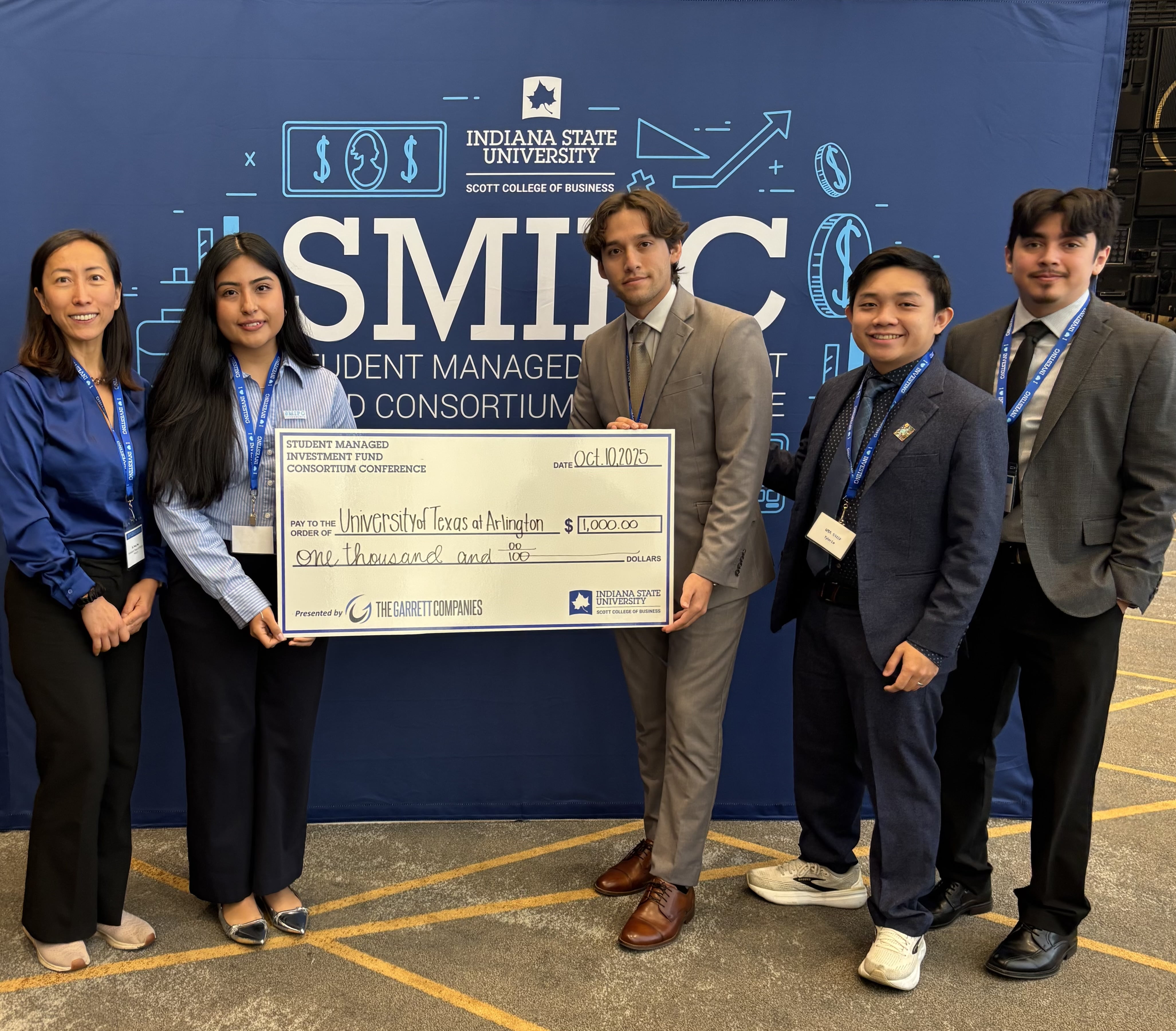 SMIF students pose for a photo with their first-place prize check.