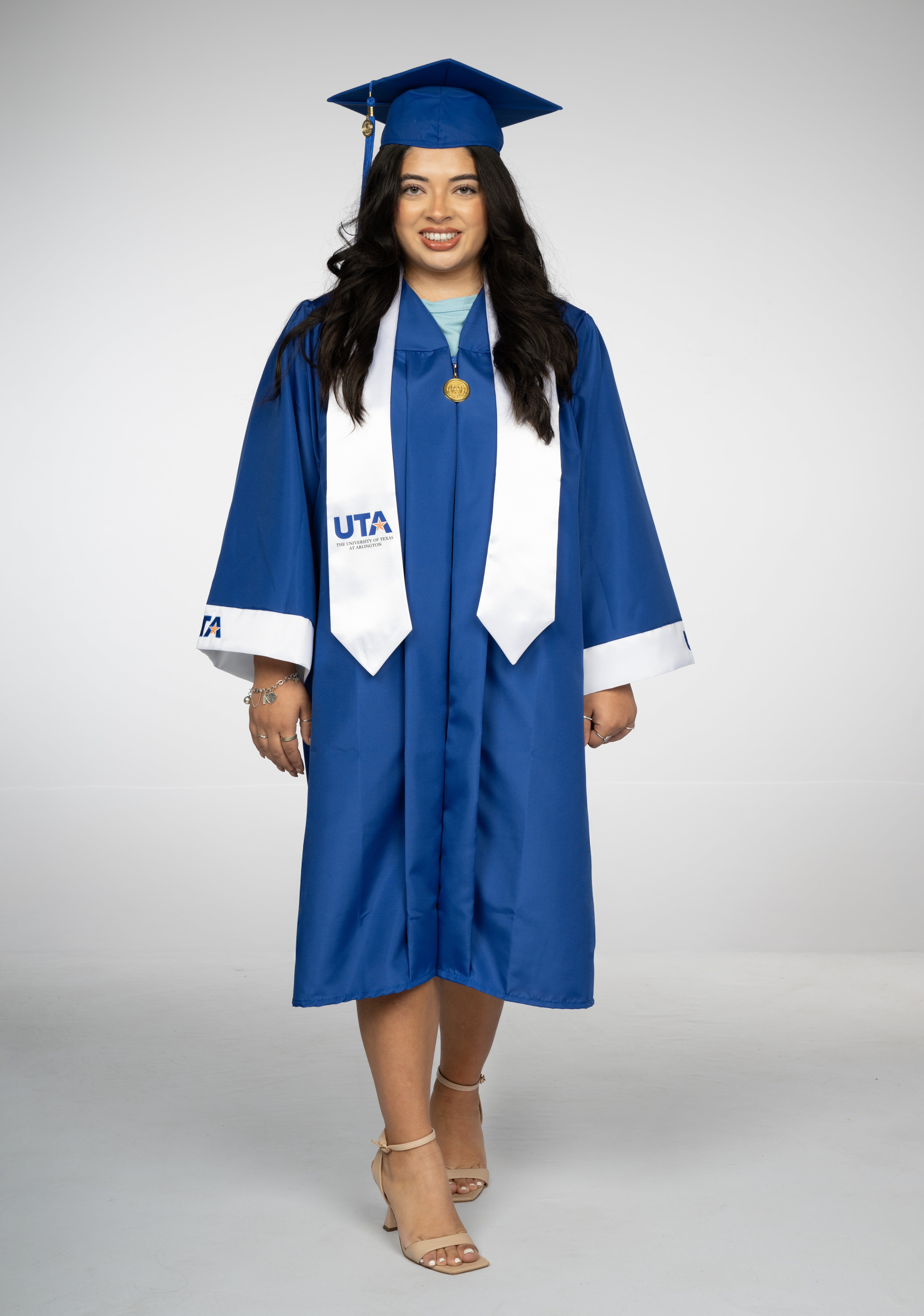 Photo of student dressed in undergraduate regalia