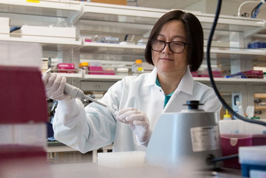 Jingsong Zhou working in lab