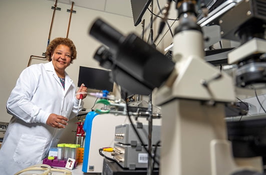 Rhonda Prisby working in lab