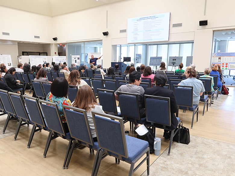 Attendees listening at CONHI Research Expo