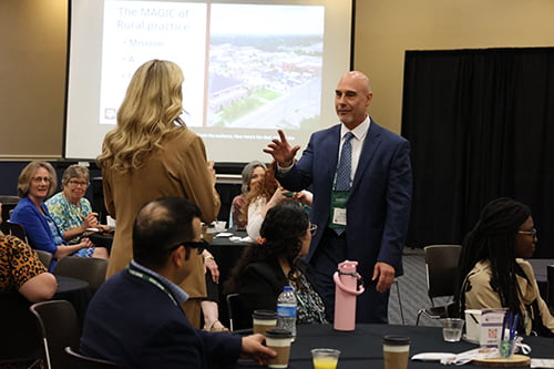 Speaker answering a question at RNO Conference.