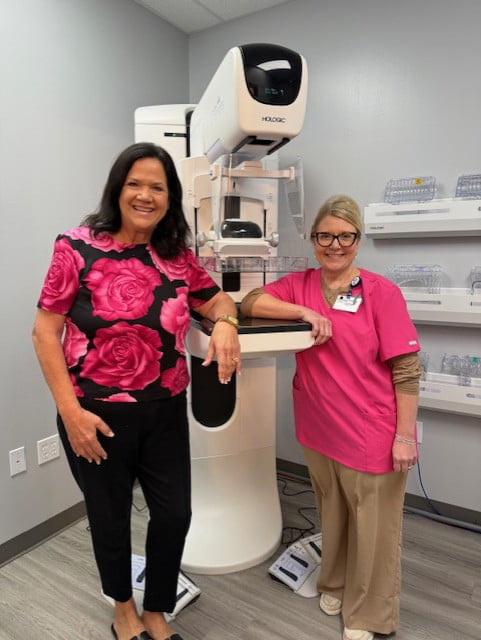 Pamela Hunt and Amy Shoppe posing inside lab area