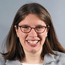 Portrait of Kristin Gigli with a grey background