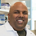 Portrait of Venu Varanassi in a laboratory