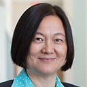 Portrait of Jingsong Zhou in an S E I R building hallway