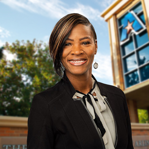 Headshot of University of Texas at Arlington employee Roneisha Below. The background shows a UTA campus sign.