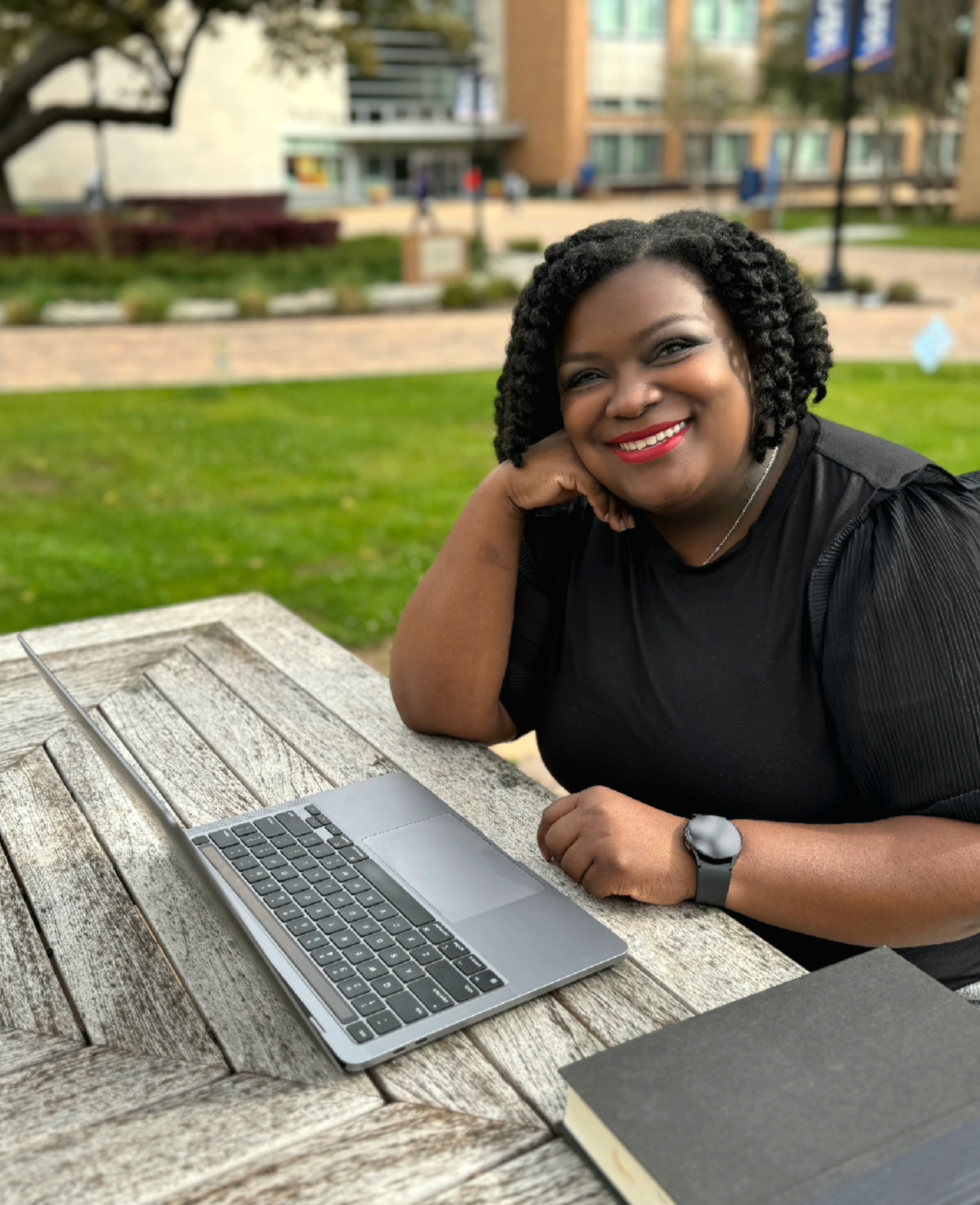 Photo of Ambra Green Working on a Laptop