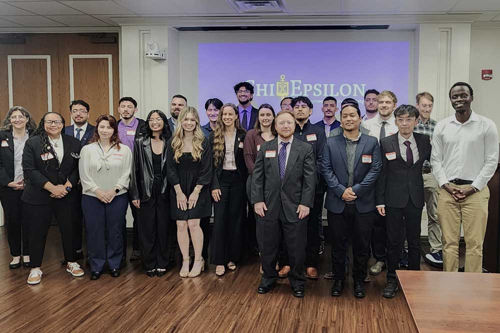 Chi Epsilon group at a meeting.