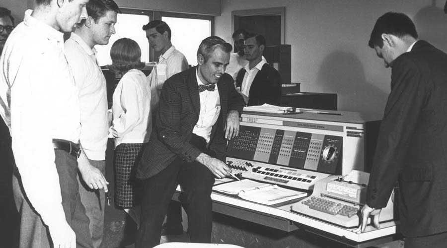 A computing device from the 1970s with students.