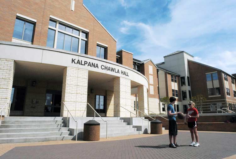 Two students in front of Kaplana Chawla Hall