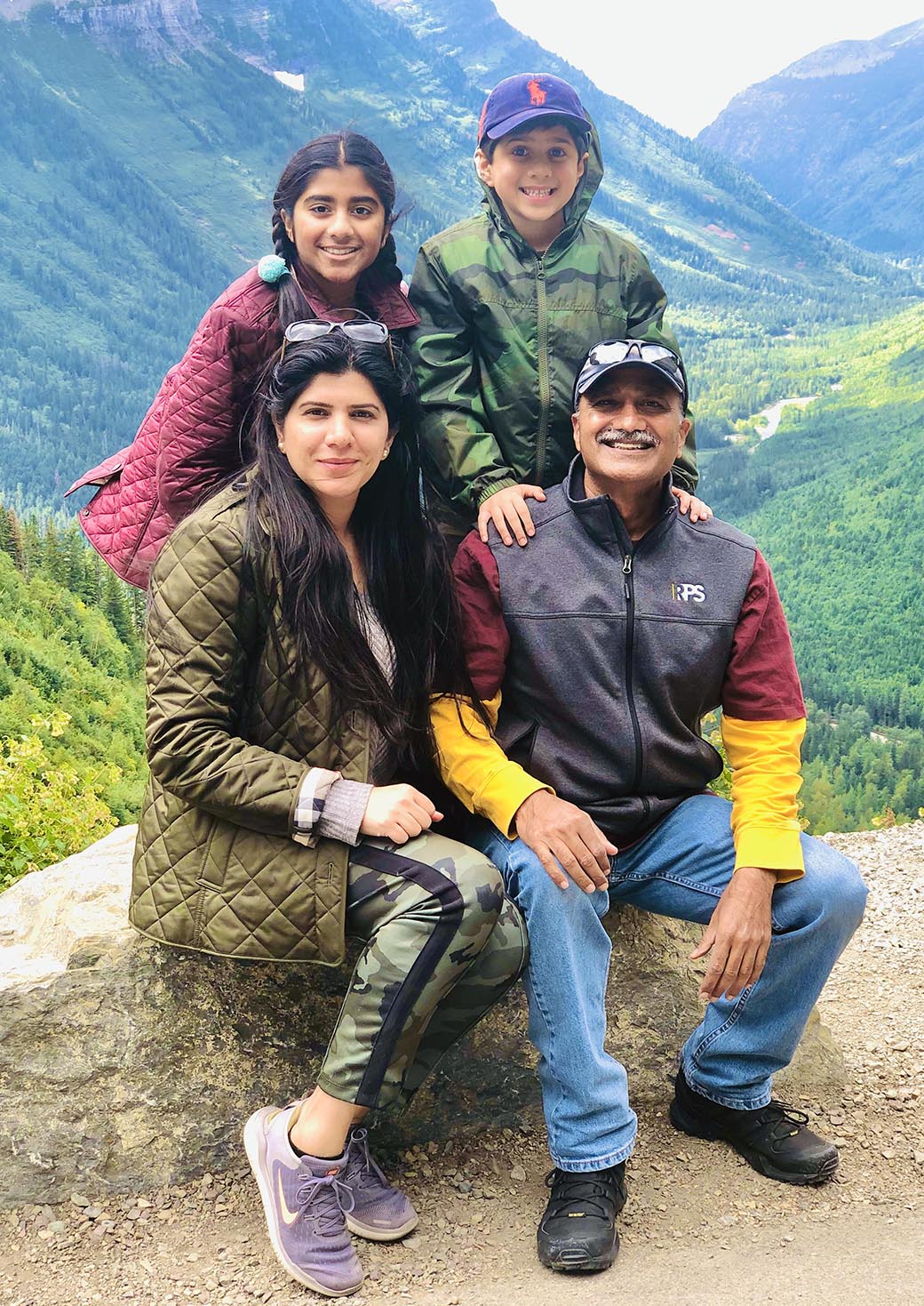 Asif Malik (seated, right), his wife, Dr. Khumara Asad (seated, left) and their children