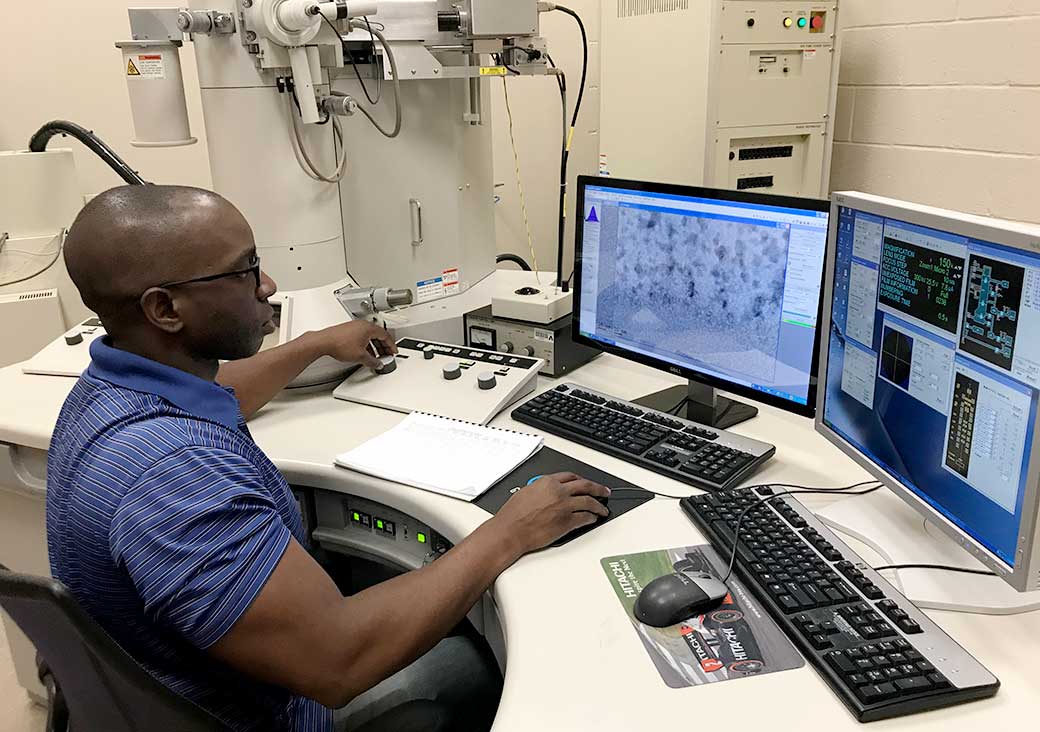 A UTA Materials Science and Engineering student works with electron microscope imaging