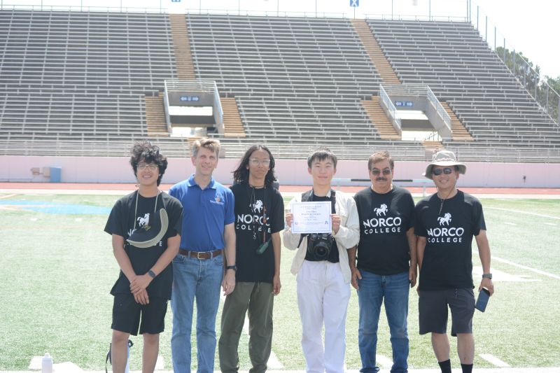 Winning team poses with award