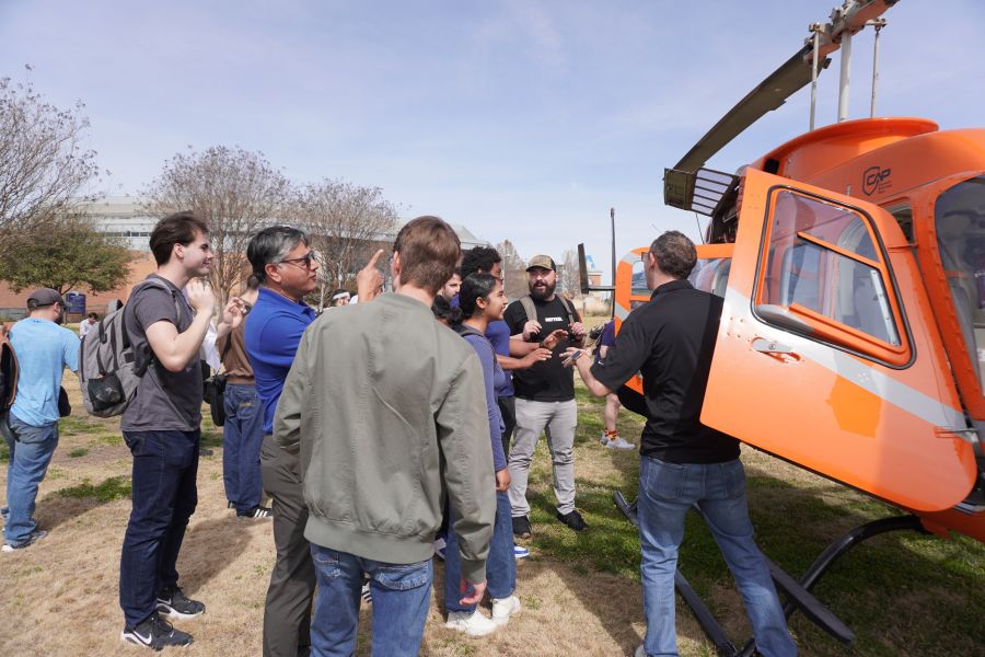 Professor discusses helicopter with students