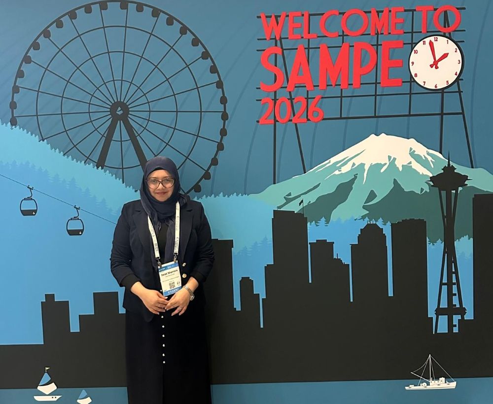 Mechanical Engineering student at entrance to SAMPE conference