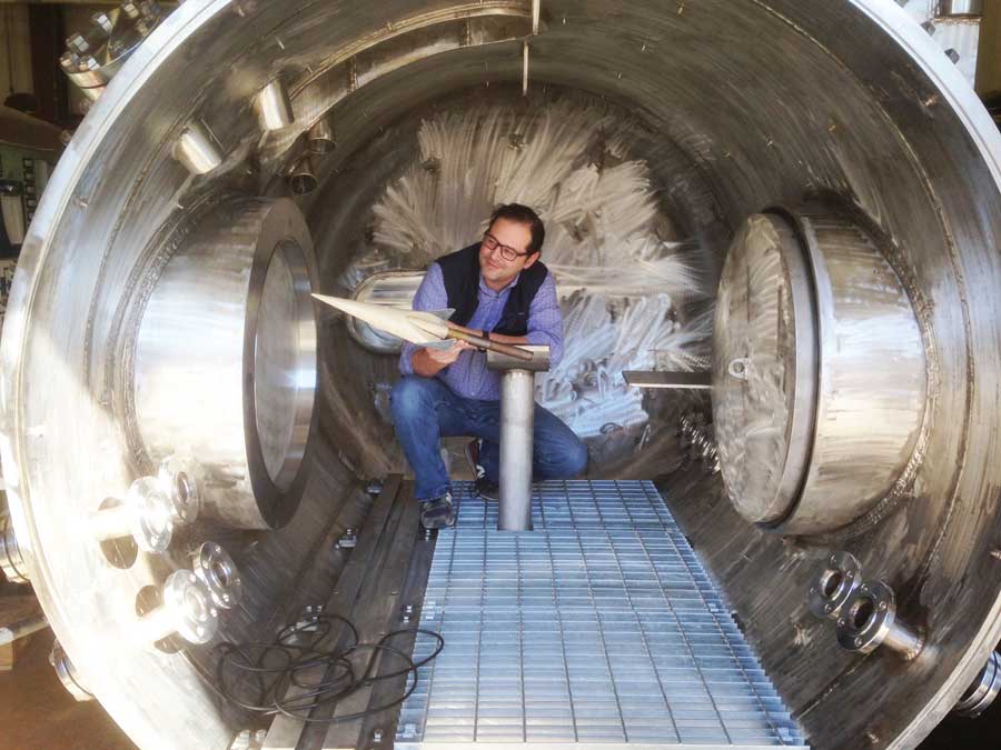 Dr. Luca Maddalena, Aerospace Engineer inside hypersonic wind tunnel." width="900" _languageinserted="true" src="https://cdn.prod.web.uta.edu/-/media/project/website/engineering/research-areas/maddalena-wind-tunnel.jpg?la=en