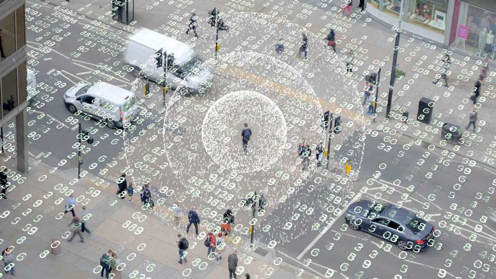 A graphic with ones and zeros flowing over a city.