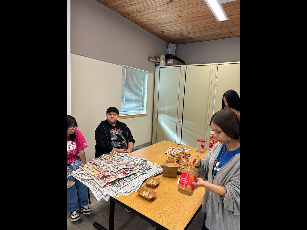 volunteers making food for the animal shelter