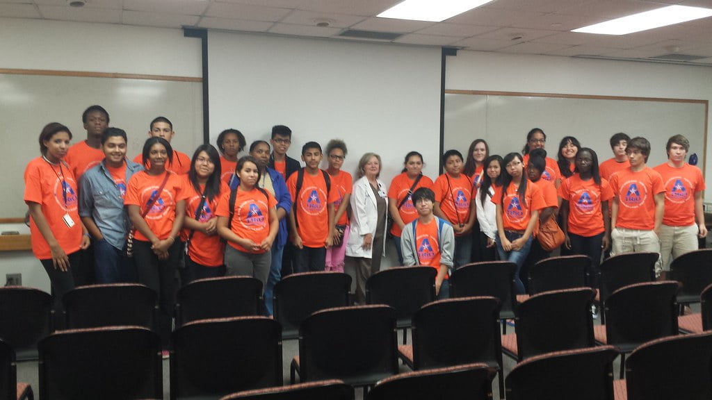 group of students wearing orange t shirt
