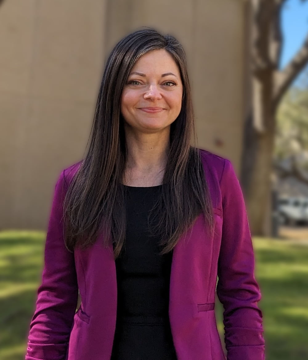 photograph of Tabitha Wiles in a purple jacket