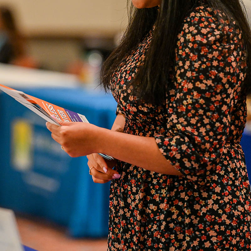 A woman holding brochure