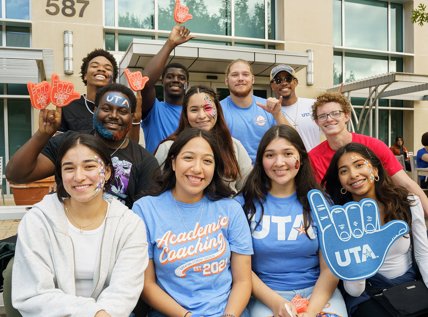 students in maverick gear and holding foam fingers