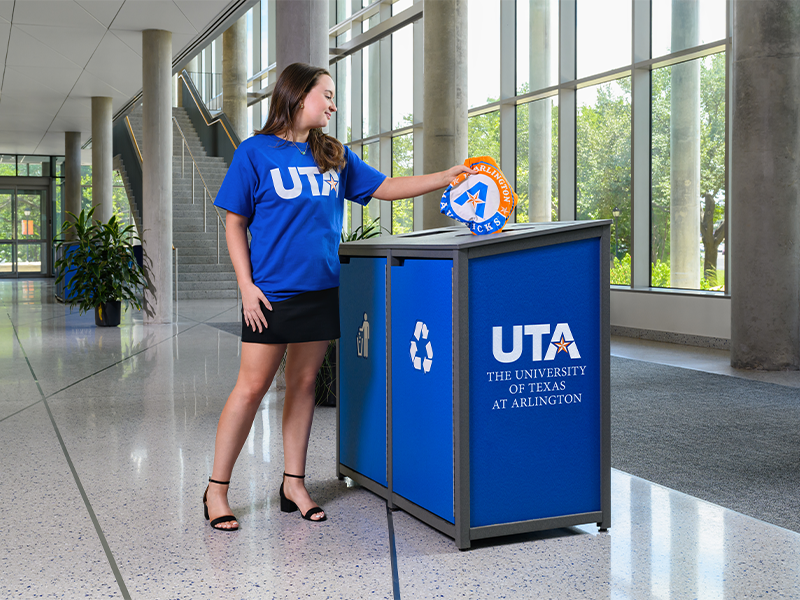 woman recycling old branding materials