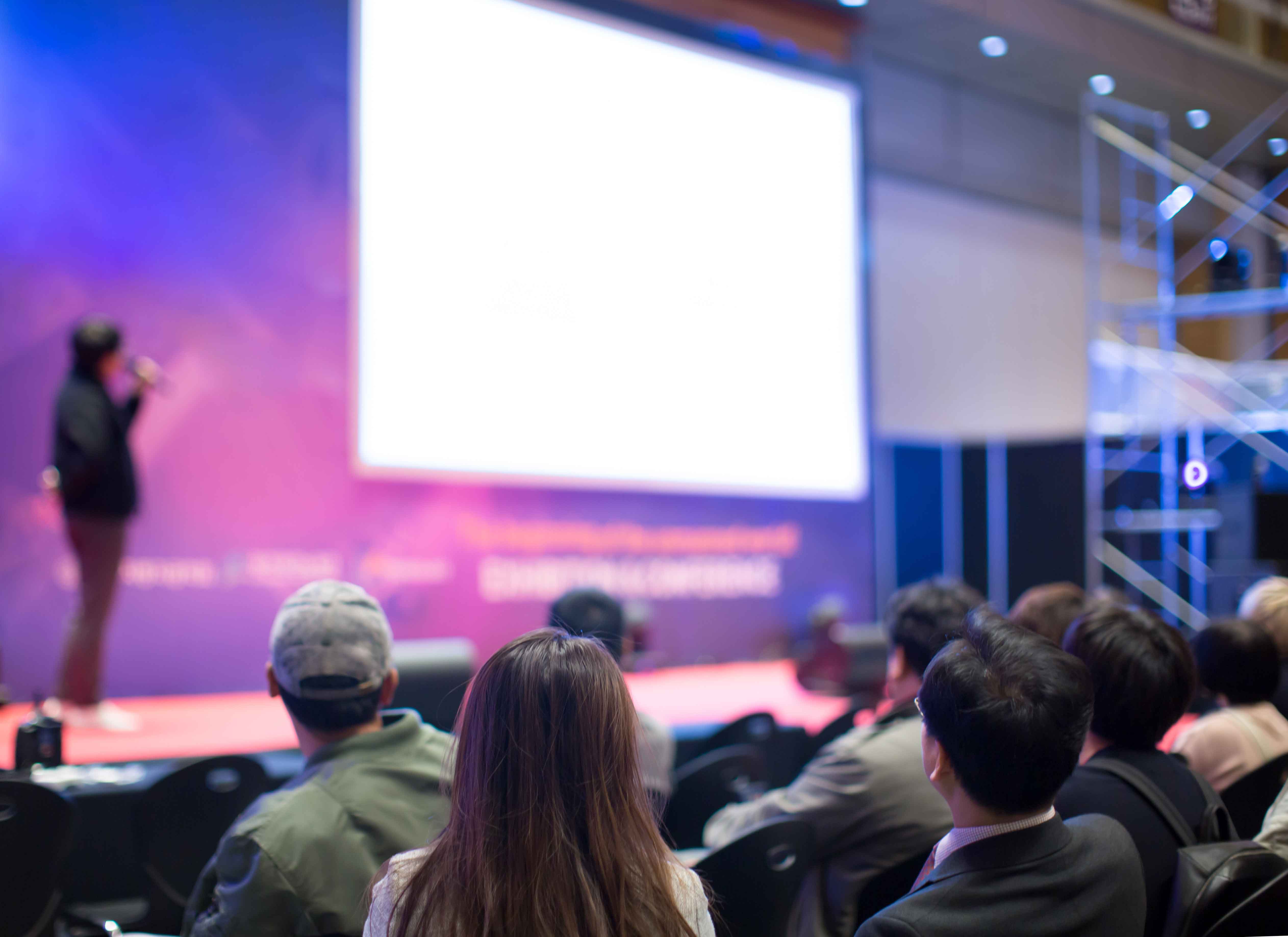 Person giving a speech to a crowd