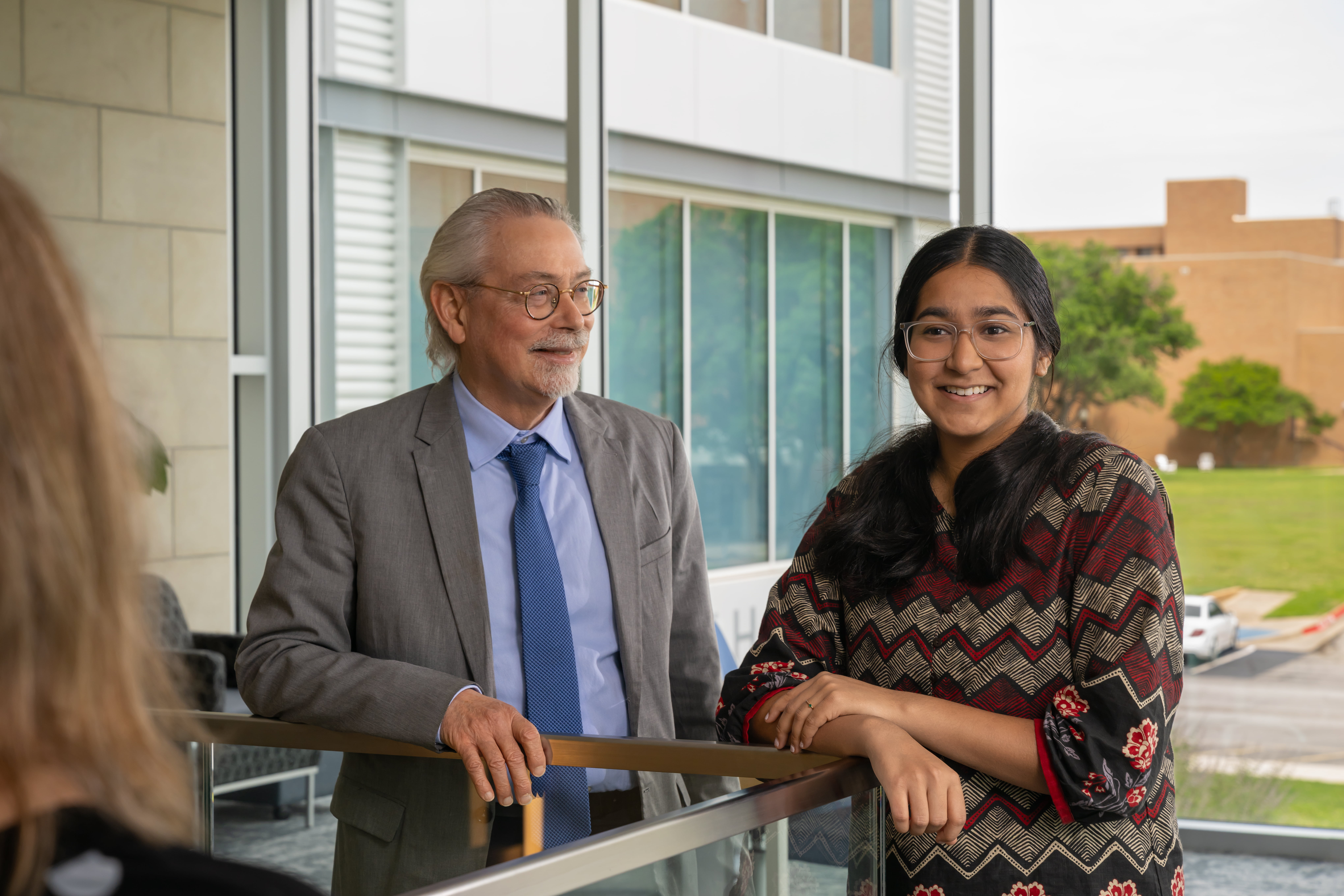 Cohost Faizah Kahn data science student and  Dr. James Grover smiling