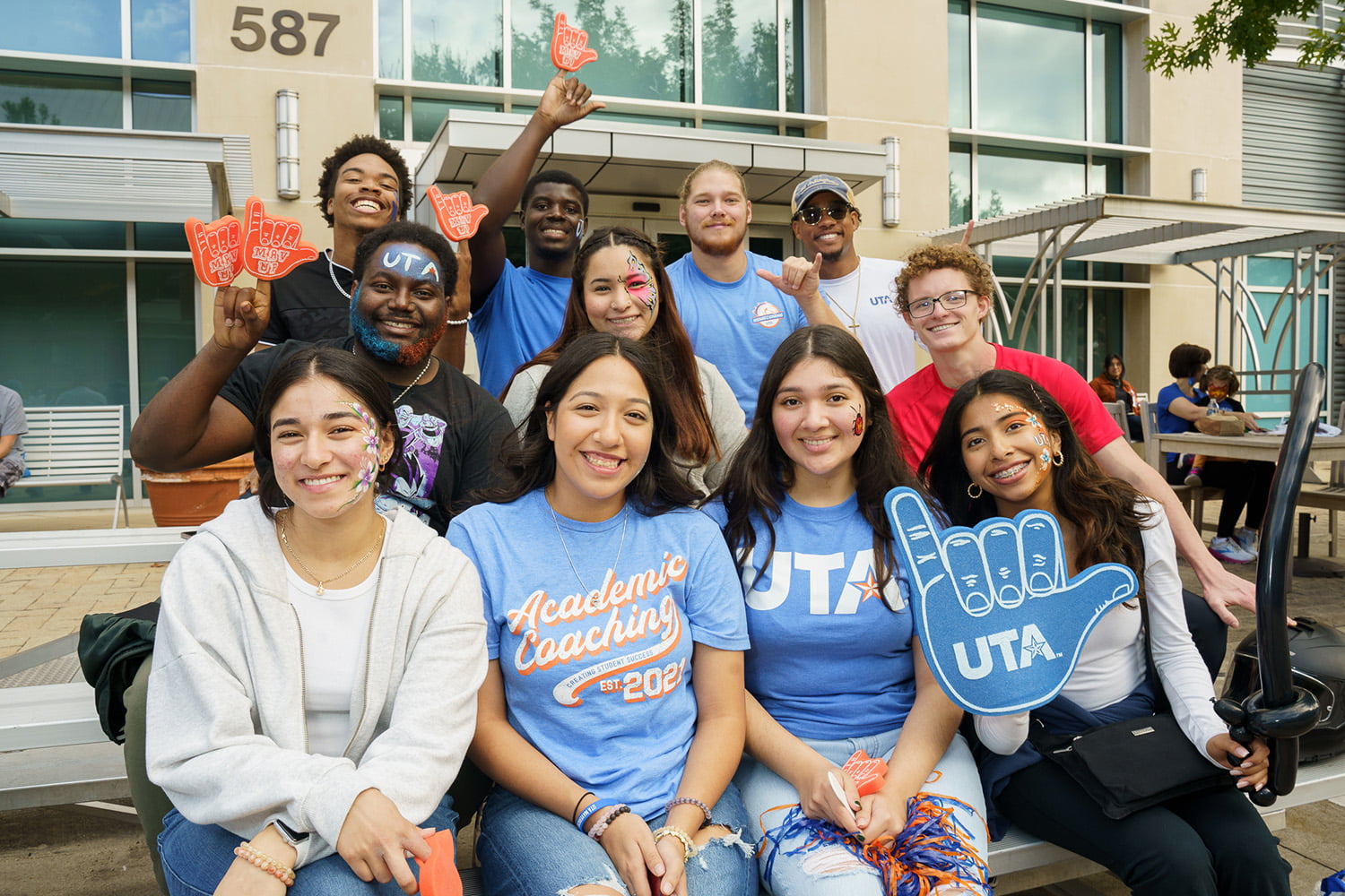 a large group of people smiling and posing for a photo