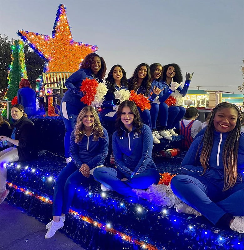 maverick spirit group on a float at the homecoming parade