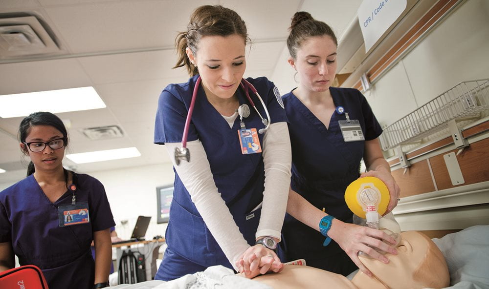 Students in the College of Nursing and Health Innovation at UTA practicing CPR