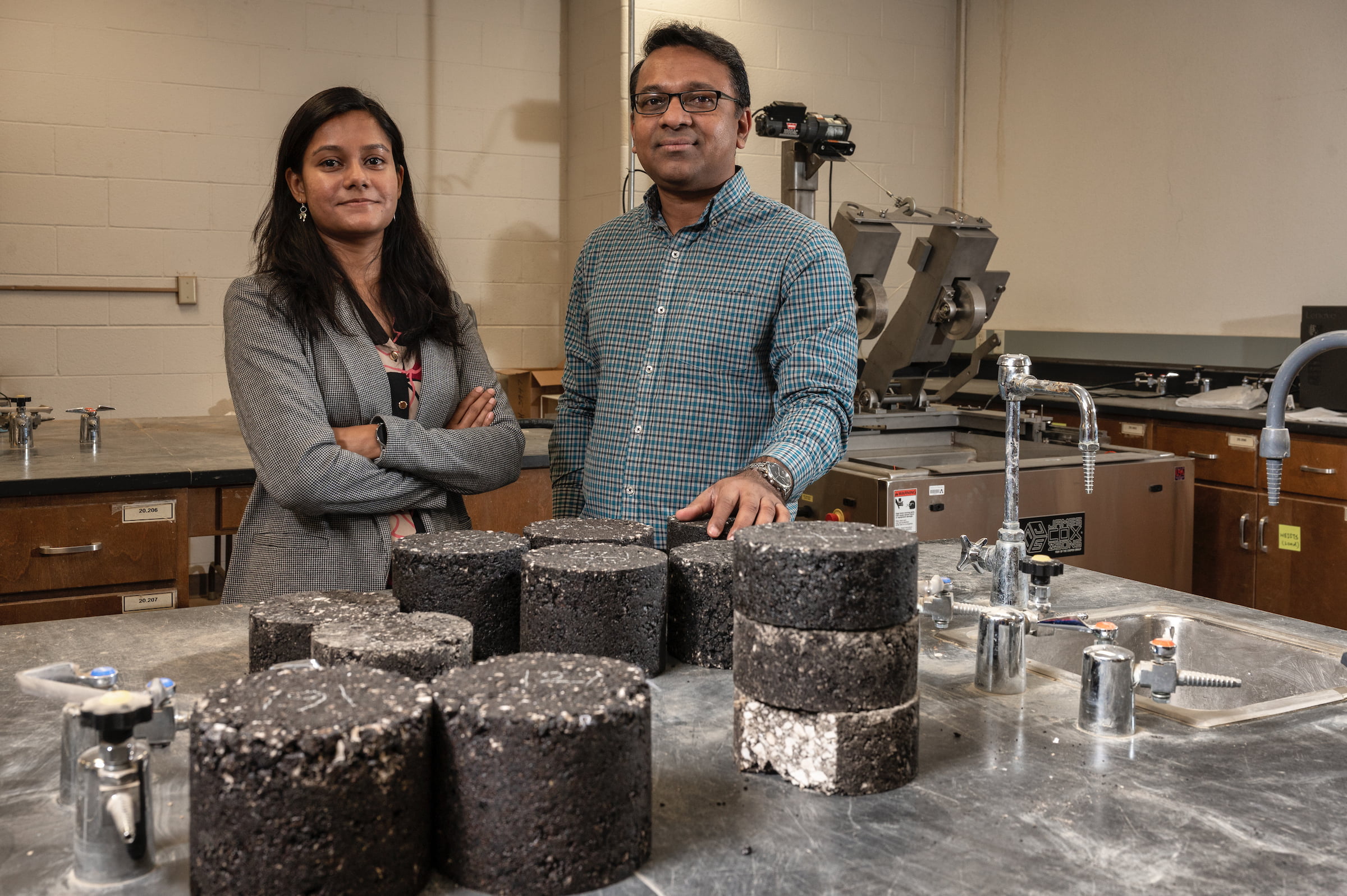Sahadat Hossain and Warda Ashraf pose with composite materials for road construction" _languageinserted="true