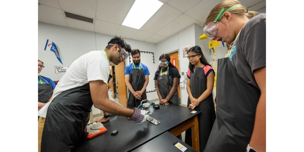 Samad Virani (’20 B.S., Physics) teaches students quantum principles. " src="https://cdn.prod.web.uta.edu/-/media/project/website/news/releases/2023/07/quantum-workshop-samad-virani.jpg?la=en" _languageinserted="true